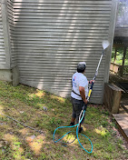 Contractor Pressure Washing Vinyl Siding